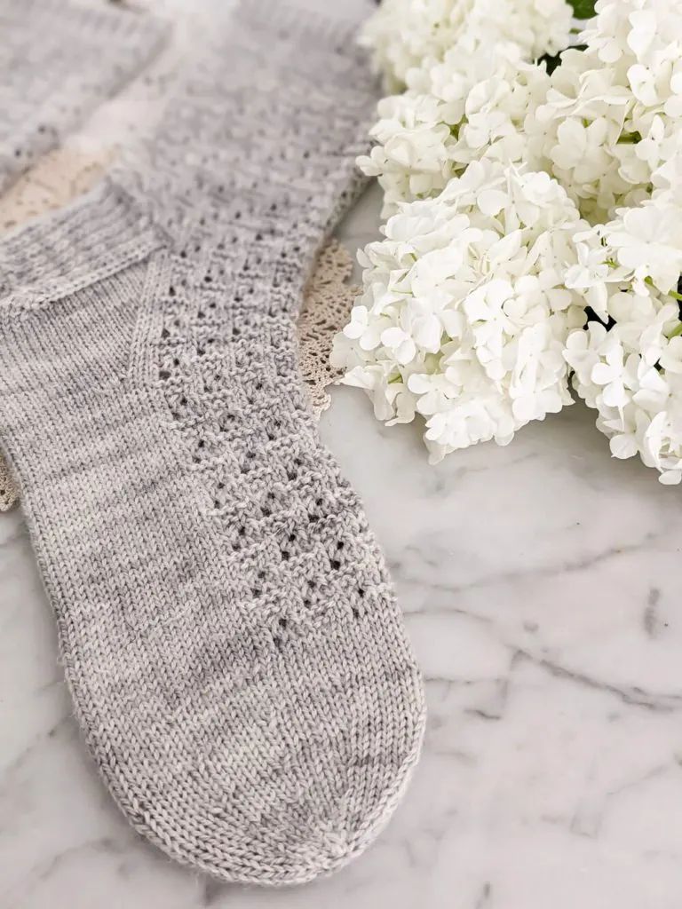 A close-up on the round toe of this free sock knitting pattern.