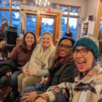 Four fiber friends bundled up in our natural habitat: a yarn shop. From left to right is Emily, me, Britt, and Beth. We're all grinning from ear to ear.