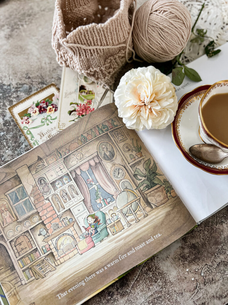 A flatlay showing an interior page of Julia's House for Lost Creatures. The picture shows her cozy sitting room with floor-to-ceiling shelves and lots of knicknacks.