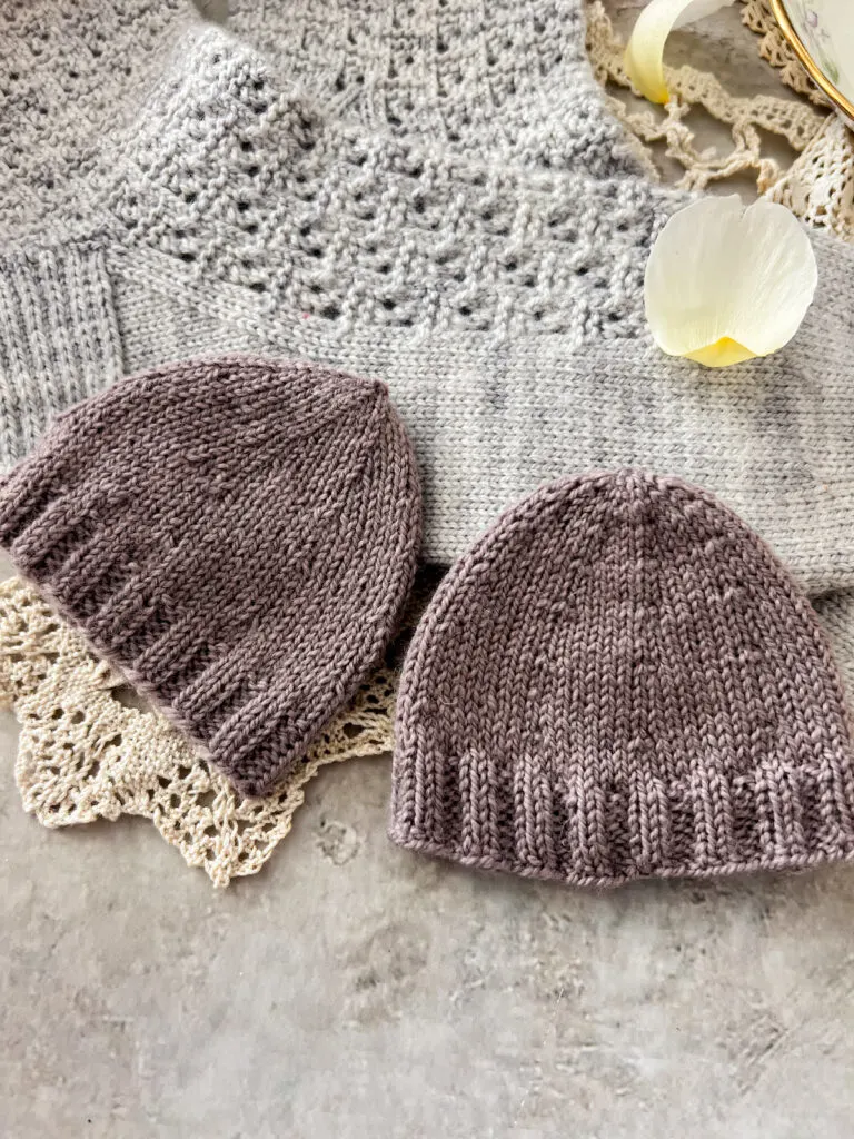 A side-by-side comparison of two swatches knit in a soft purple yarn. The swatch on the left shows a round toe knit from the cuff down using decreases for the shaping. The right swatch shows a round toe knit from the toe up using increases for the shaping.