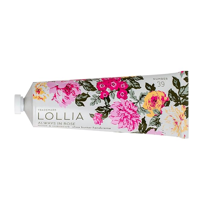 A white tube of hand cream with lots of pink and peach flowers printed on it.