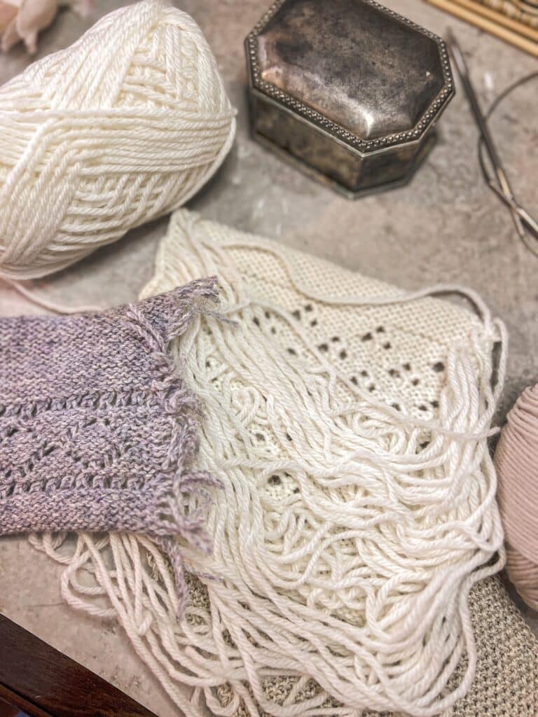 A photo showing the reverse sides of two speed swatches. The gray one on the left has had its floats trimmed while the white one on the right has its floats intact. The white swatch's floats look kind of like an unraveled skein.