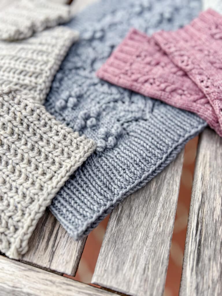 A close-up photo showing the 1 x 1 ribbing on the edge of a blue handknit cowl.